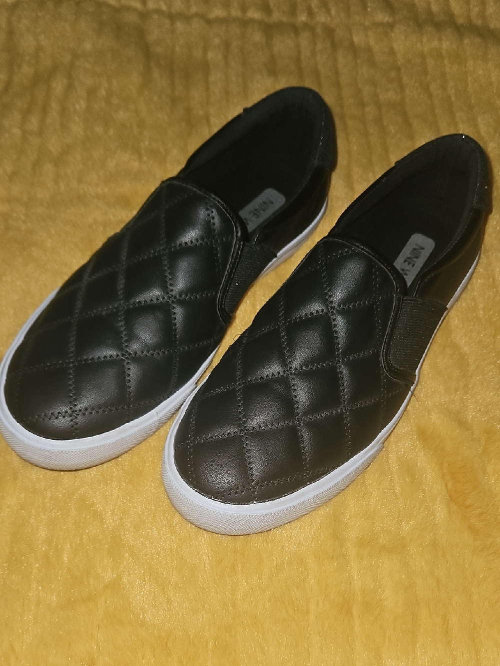 Nine West Quilted Black Slip-On Sneakers with White Sole